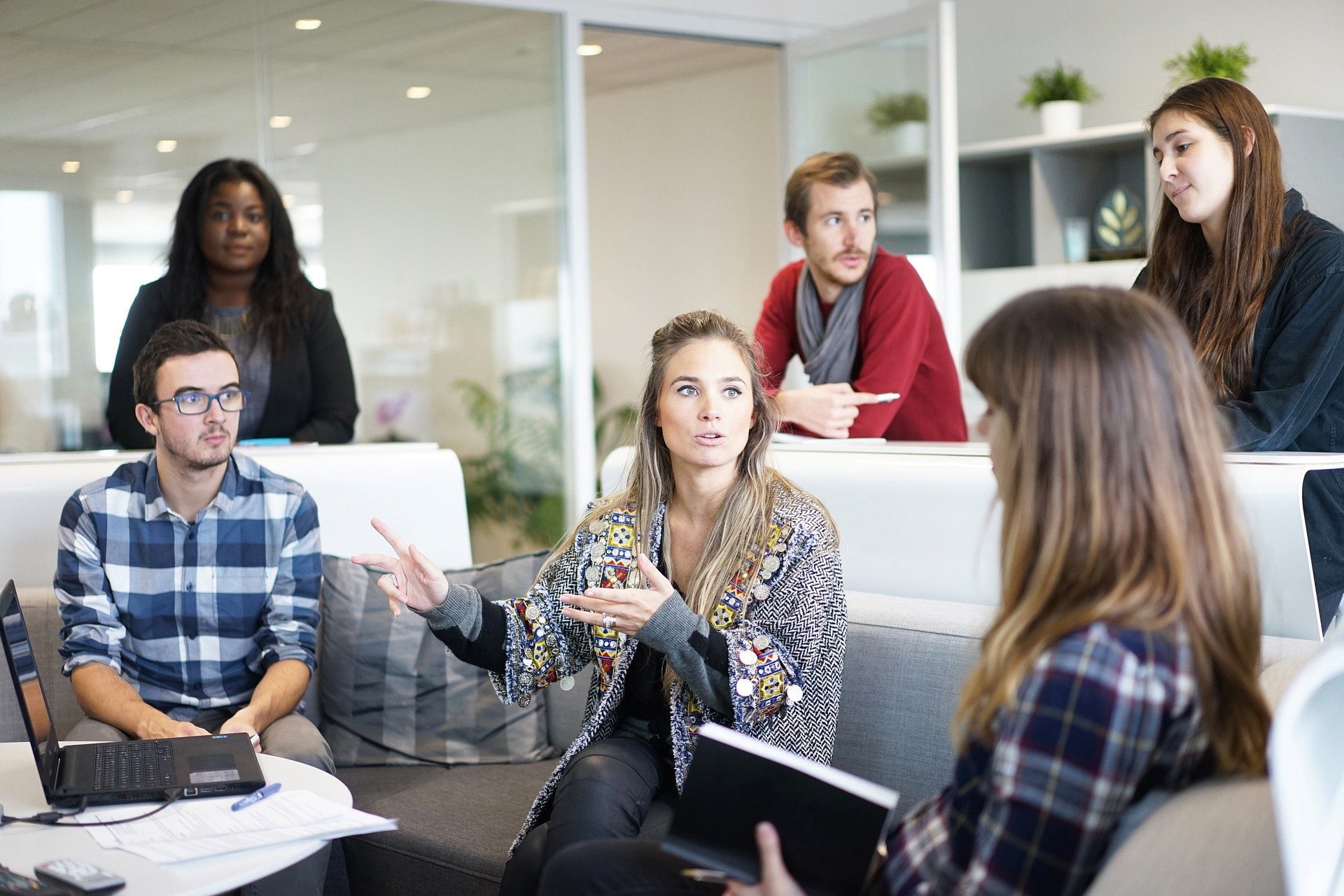 Manager speaks with employees